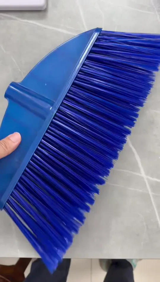 Blue broom head with bright, glossy PET bristles checked for color consistency