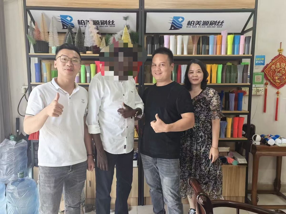 Customer visiting the BMY showroom with colorful broom filament displays