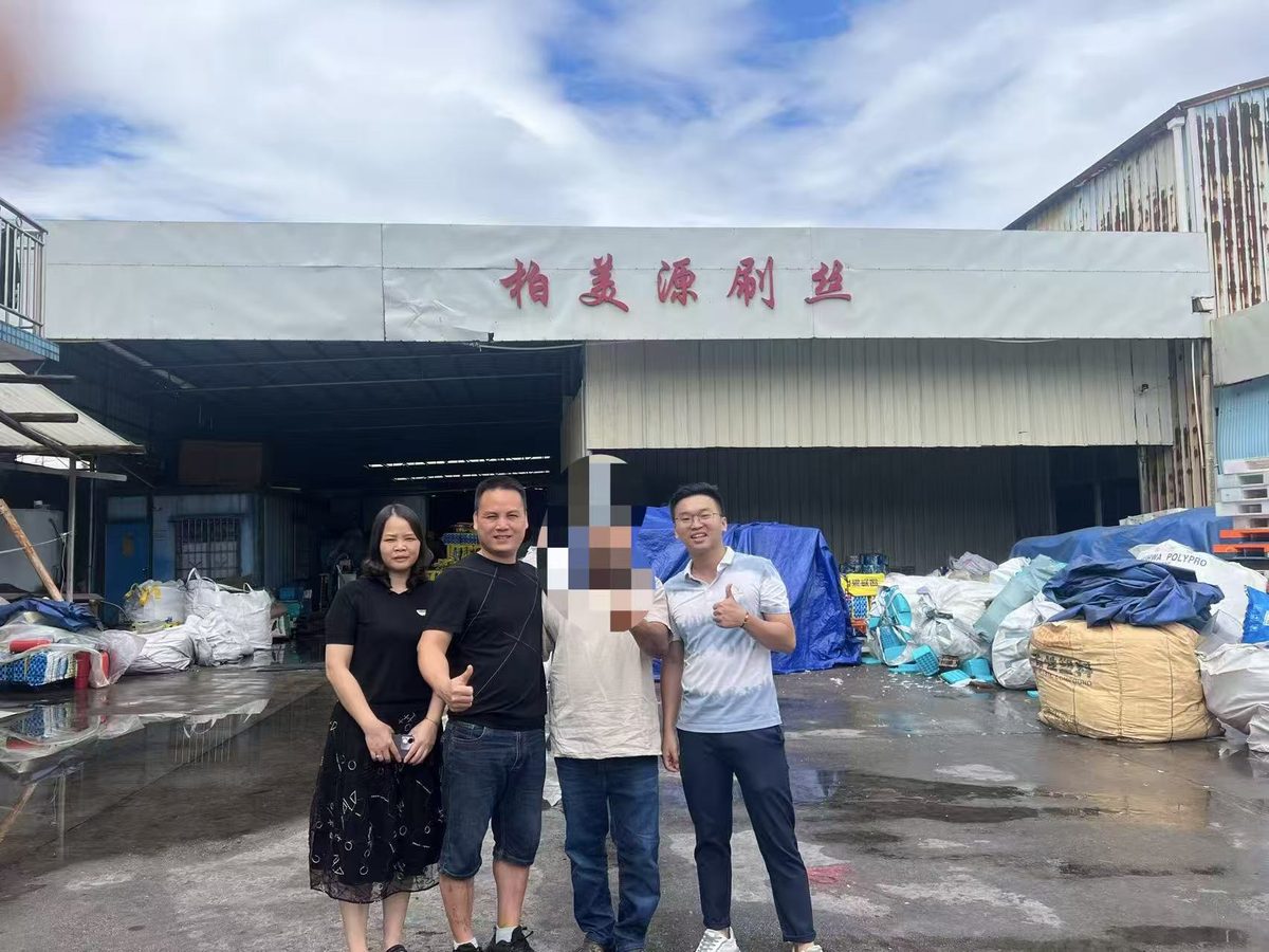 Buyer posing at the BMY factory entrance