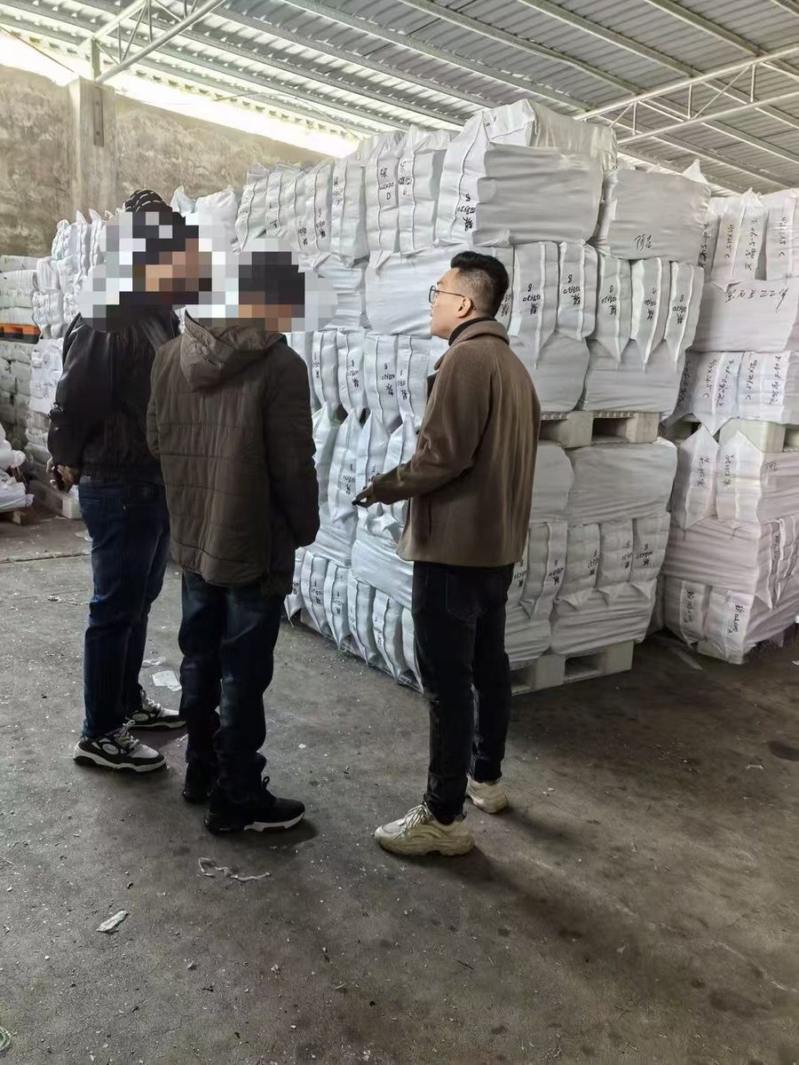 Buyer inspecting packed filament stock in the warehouse